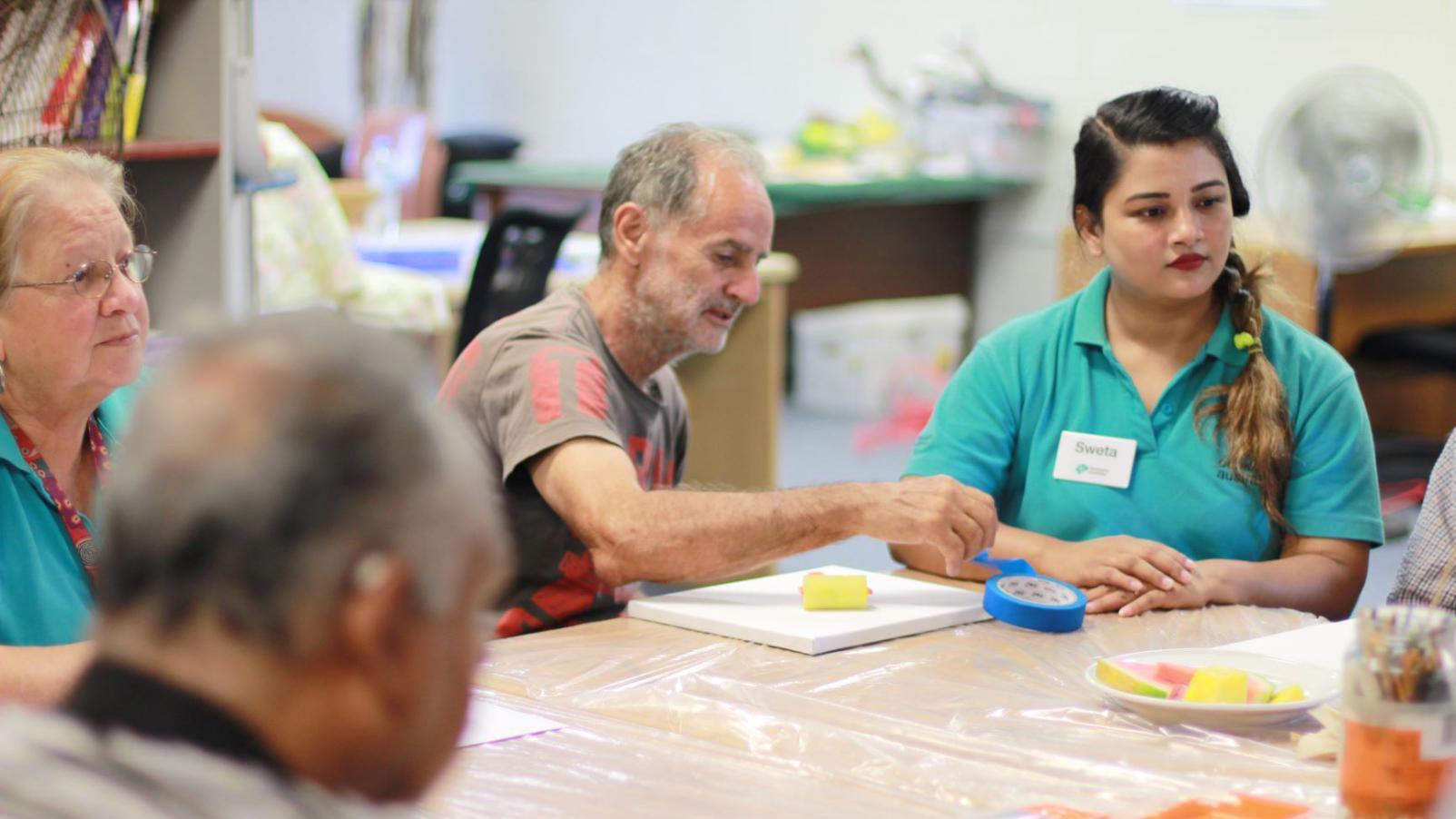 An art class in progress for people living with dementia in Darwin. 