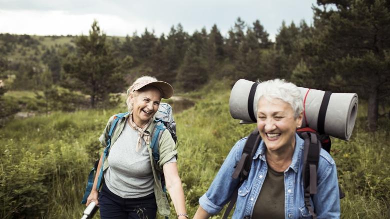 couple holding hands and hiking in the wilderness