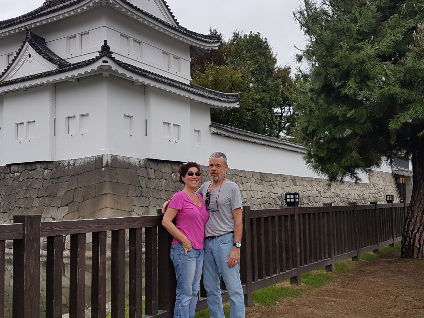 David and Leisa posing in front of an asian style building.