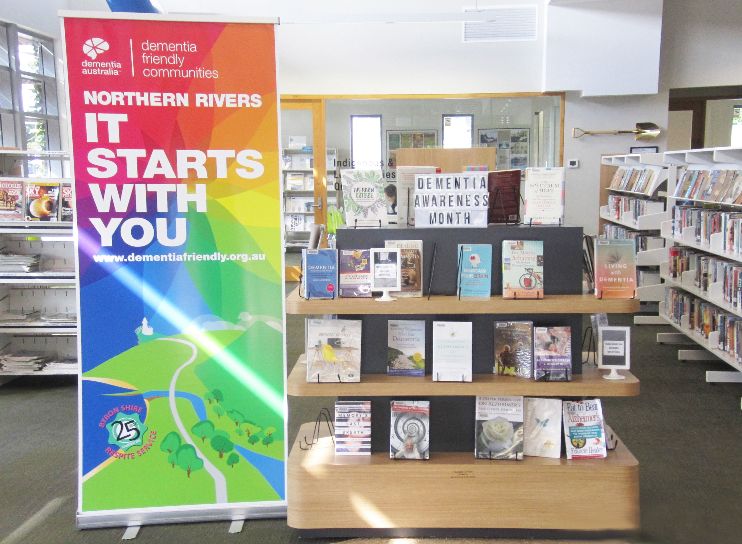 A dementia pop-up stall setup by Karen Harborow from the Byron Shire Project, promoting dementia awareness.